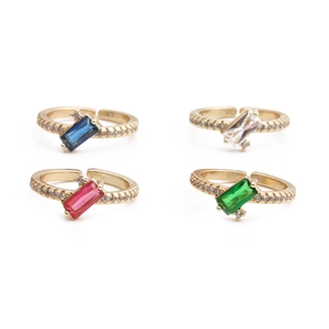 Detail of four adjustable 18K gold plated rings with colorful rectangle zircon stones