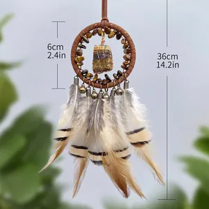Bohemian car pendant with tiger eye stones and feathers in a natural green background