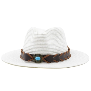 Detailed view of white straw hat with brown leather band and turquoise stone accent