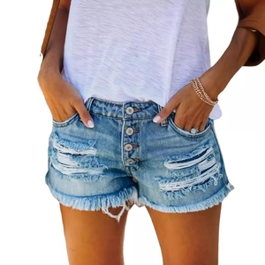 High-waisted light blue distressed denim shorts with fringe hem and five-button closure
