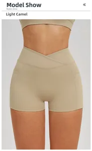 Detail view of high waist yoga shorts featuring V-shaped cross waistband and side pockets