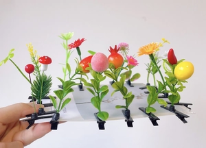 Detailed set of 11 creative hair clips with miniature flowers, mushrooms, and fruits