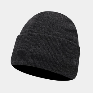 Detail of dark grey ribbed knit beanie showing soft texture and folded brim for winter