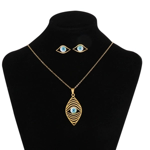 Bohemian gold evil eye jewelry set featuring leaf pendant necklace and stud earrings