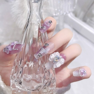 Handmade purple galaxy press-on nails with rhinestone butterfly and bear charms