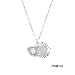 Elegant silver shell pendant necklace with sparkling diamonds and a white pearl
