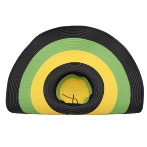 Flat lay of large brim woven straw hat with Rasta stripes and black windproof chin strap