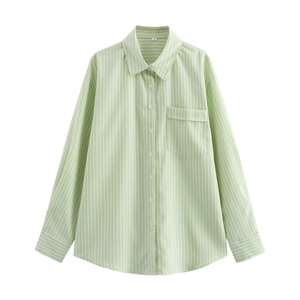 Detail of light green vertical striped shirt featuring a single breast pocket and collar