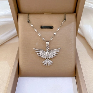 Detailed close-up of eagle pendant necklace with sparkling cubic zirconia in a jewelry box