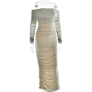 Detail of the elegant ruched mesh fabric and off-shoulder design on the sage green dress