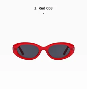 Detail view of oval red frame sunglasses with C03 dark grey lenses and metal studs