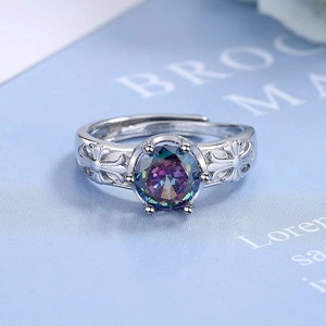 Vintage silver adjustable ring featuring a round colorful zircon and hollow carved patterns