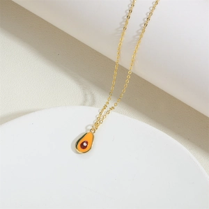 Close-up of 14K gold plated necklace featuring a detailed avocado fruit pendant