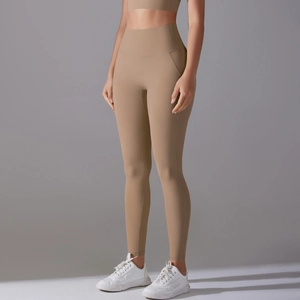 Close-up of high-waisted seamless khaki yoga leggings with a matte finish and tight fit