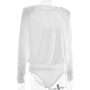 Detailed view of white long sleeve bodysuit with pleated texture and bottom snap closure