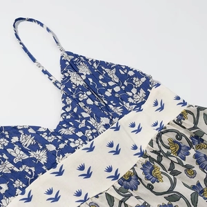 Detail of floral patchwork sundress showing the mixed patterns and fabric texture