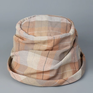 Detail of blue plaid bucket hat fabric with natural pleated texture and thick weave