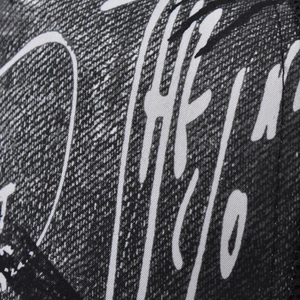 Close-up of a gradient baseball cap with trendy black and white graffiti print texture