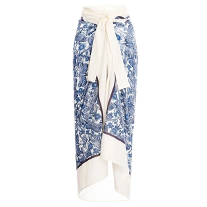 Detail of blue and white floral print maxi dress with waist tie and irregular hemline