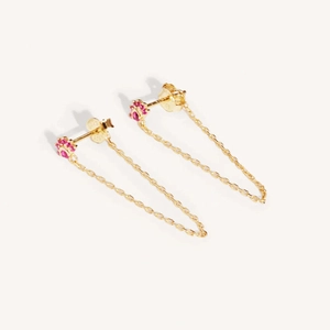Detail of gold chain earrings with pink gemstone cat paw design and tassel link