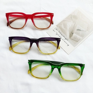 Retro oversized square blue light blocking glasses with vibrant gradient frames on white fabric