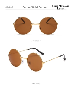 Detail view of round retro sunglasses featuring gold metal frames and brown ocean lenses