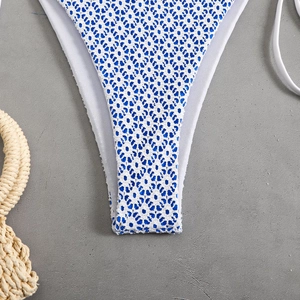 Sexy blue and white crochet bikini set with halter neck and high cut leg for beachwear