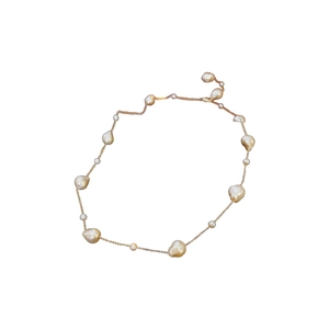 French vintage gold-plated irregular baroque pearl necklace on a clean white background
