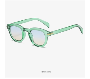 45-degree side view showing green acetate frame with gold arrow metal detail on sunglasses