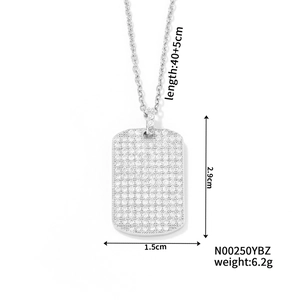 Detail shot of a silver square pendant necklace featuring dense rhinestone pavé inlay