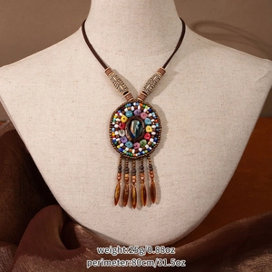Detail of bohemian tassel necklace showing dimensions 25g weight and 80cm length