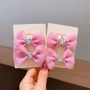Pink ribbon bow hair clip set with heart crystal and crown detail for little girls