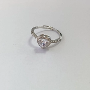 Detailed view of silver heart ring featuring clear zircon center and adjustable open band