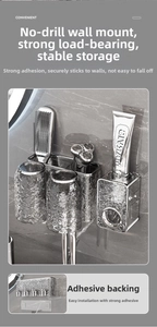 Detail showing wall-mounted toothbrush holder set with automatic toothpaste dispenser