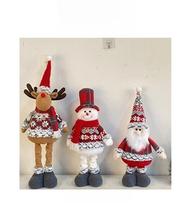 Detailed view of plush Christmas trio featuring a reindeer, snowman, and Santa Claus