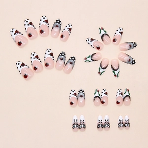 Macro shot of 3D ladybug and flower press-on nails with polka dots and bows in almond shape
