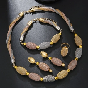 Detailed shot of tricolor mesh beaded jewelry set with gold silver and rose gold finish