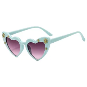 Mint green heart-shaped kids sunglasses with 3D daisy flowers and purple gradient lenses