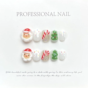Detail of Christmas 3D press-on nails with Santa Claus, Christmas tree and candy cane art