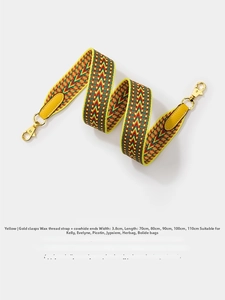 Detail of 3.8cm wide chevron woven strap with yellow leather ends and gold metal buckles