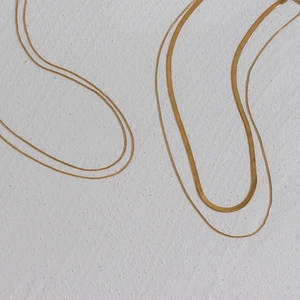 Detail of 18K gold-plated stainless steel layered necklace with snake and blade chains