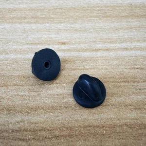 Halloween ghost cat pumpkin pins with black rubber clutch backings on wood surface