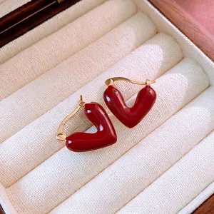 Vintage red heart hoop earrings with gold-plated metal finish in minimalist style