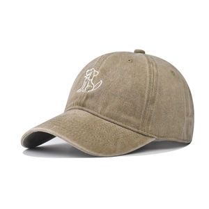 Washed khaki cotton baseball cap with embroidered dog outline and curved brim