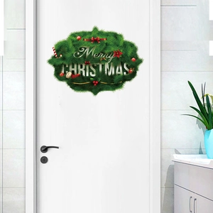 Detail of Merry Christmas door sticker with festive green wreath and red bow design