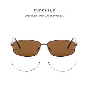 Detailed view of rectangular brown lenses and slim metal frames on vintage sunglasses