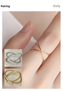 Detailed view of 18k gold plated stainless steel intertwined X-shaped crossover ring
