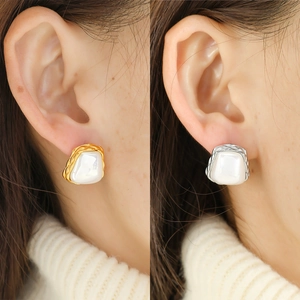 French retro square pearl earrings in gold and silver finish on a model