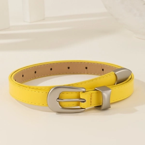 Minimalist yellow leather belt for women with matte silver alloy buckle on white background