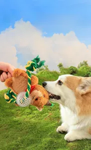 Owner playing with corgi using electric plush reindeer dog toy with rope and spike ball